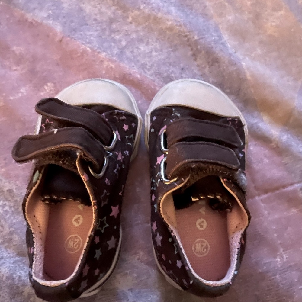 The shoes are brown with pink and blue stars the are really cute on